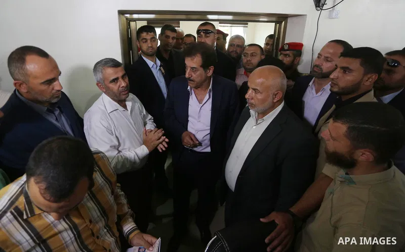 Chief of General Committee for Crossings and Borders in the Palestinian Authority, Nazmi Mohana visits the passenger registration service headquarter "Abu Khadra Governmental Complex" in Gaza city on October 16, 2017. Ph...