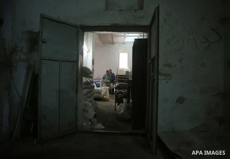 Palestinian laborers work at a Al-Adham old flour mill in the old town of West Bank city of Nablus October 10, 2017. Al-Adham mill Was founded in 1945 and grinds all kinds of grains, such as wheat, beans, chickpeas, on m...