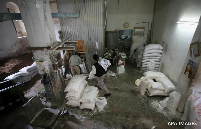 Palestinian laborers work at a Al-Adham old flour mill in the old town of West Bank city of Nablus October 10, 2017. Al-Adham mill Was founded in 1945 and grinds all kinds of grains, such as wheat, beans, chickpeas, on m...