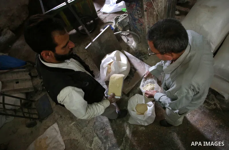 Palestinian laborers work at a Al-Adham old flour mill in the old town of West Bank city of Nablus October 10, 2017. Al-Adham mill Was founded in 1945 and grinds all kinds of grains, such as wheat, beans, chickpeas, on m...