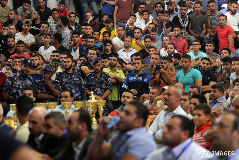Palestinians attend a bodybuilding competition, which organized by Palestinian Federation of Bodybuilding and Fitness (PFBB), in Gaza city on October 20, 2017. Photo by Mohammed Asad