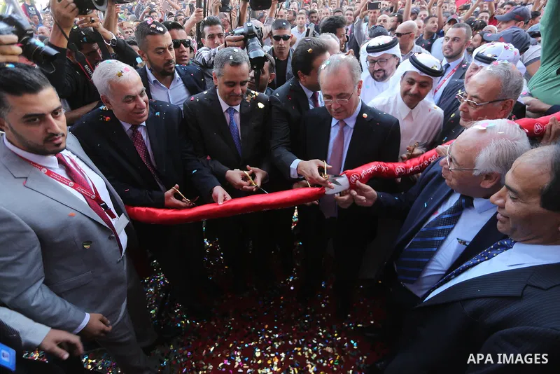 Palestinians take part in the launching services ceremony of Al-Wataniya Mobile Palestine in Gaza City October 24, 2017. Palestinian company Wataniya Mobile announced that it will launch its telecommunications services i...