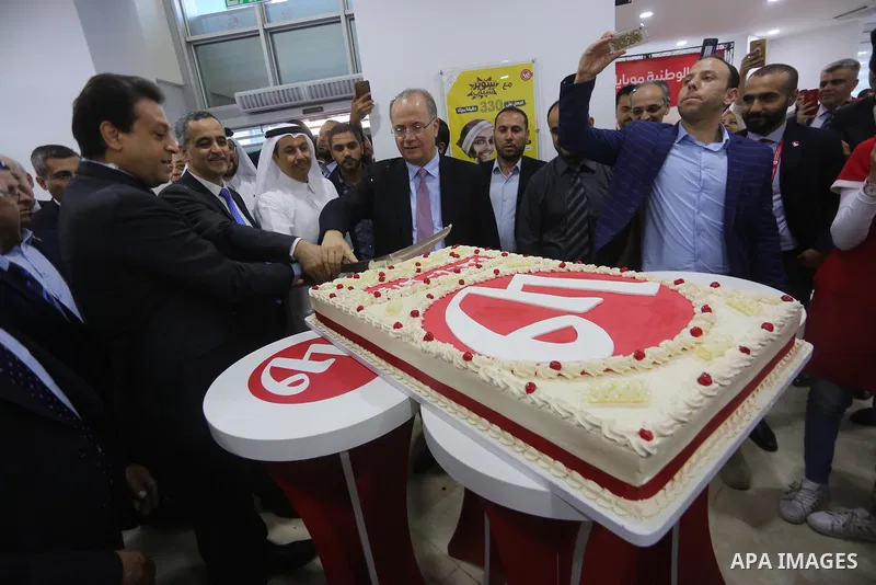 Palestinians take part in the launching services ceremony of Al-Wataniya Mobile Palestine in Gaza City October 24, 2017. Palestinian company Wataniya Mobile announced that it will launch its telecommunications services i...