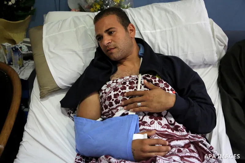 An Egyptian policeman injured during the anti-terror shootout in the desert of Giza province receives medical treatment in a police hospital in Giza, Egypt, on Oct. 26, 2017. 16 policemen were killed and another went mis...