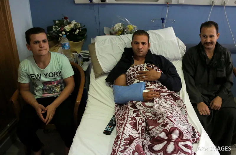 An Egyptian policeman injured during the anti-terror shootout in the desert of Giza province receives medical treatment in a police hospital in Giza, Egypt, on Oct. 26, 2017. 16 policemen were killed and another went mis...