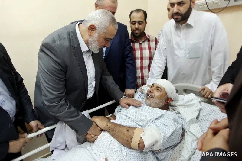 Hamas Chief Ismail Haniya visits Tawfiq Abu Naim, director general of the internal security forces, at a hospital in Gaza City. The head of Hamas security forces in the Gaza Strip was injured a day earlier when his car e...