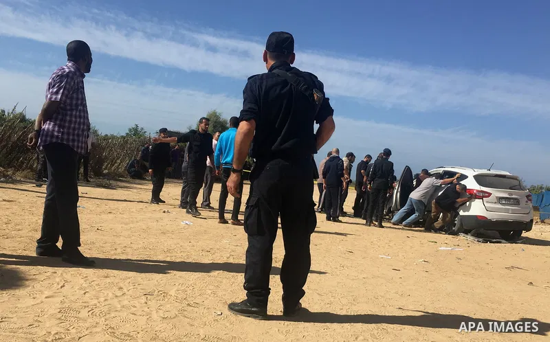 Palestinian policemen stand guard after Tawfeeq Abu Naeem's car exploded director general of the internal security forces in the central Gaza Strip October 27, 2017. The head of Hamas security forces in the Gaza Strip wa...