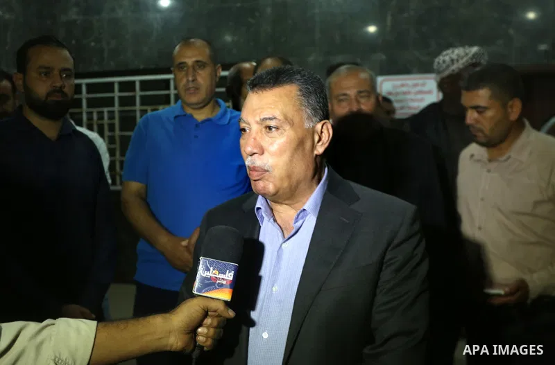 Ahmed Hilles, top Fatah official in Gaza speaks to media following his visiting Tawfiq Abu Naim, director general of the internal security forces at al-Shifa hospital after he was wounded in a car bombing, in Gaza City O...
