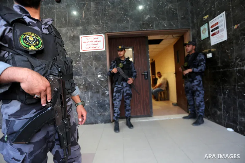 Palestinian security forces stand guards outside al-Shifa hospital where Tawfiq Abu Naim, director general of the internal security forces is recovering after he was wounded in a car bombing, in Gaza City October 27, 201...
