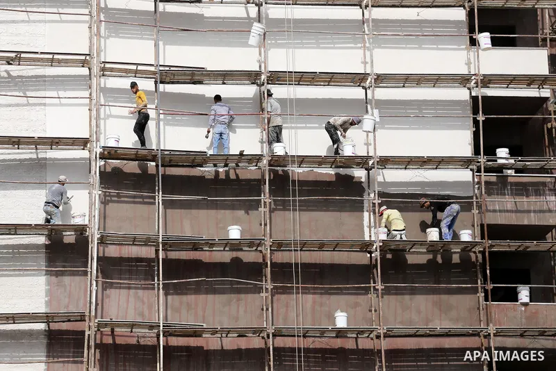 Palestinian laborers construction work at building still under construction, in Gaza city on October 28, 2017. Property owners in the Gaza Strip suffer from weak market and sales, and according to World Bank's report Gaz...