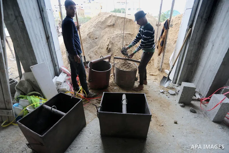 Palestinian laborers construction work at building still under construction, in Gaza city on October 28, 2017. Property owners in the Gaza Strip suffer from weak market and sales, and according to World Bank's report Gaz...