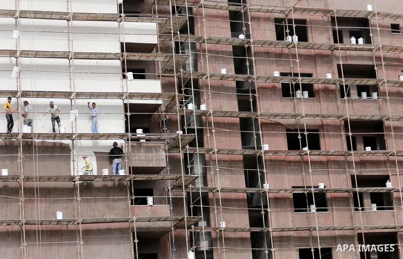Palestinian laborers construction work at building still under construction, in Gaza city on October 28, 2017. Property owners in the Gaza Strip suffer from weak market and sales, and according to World Bank's report Gaz...