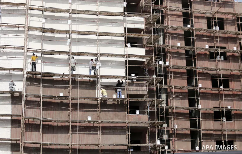 Palestinian laborers construction work at building still under construction, in Gaza city on October 28, 2017. Property owners in the Gaza Strip suffer from weak market and sales, and according to World Bank's report Gaz...
