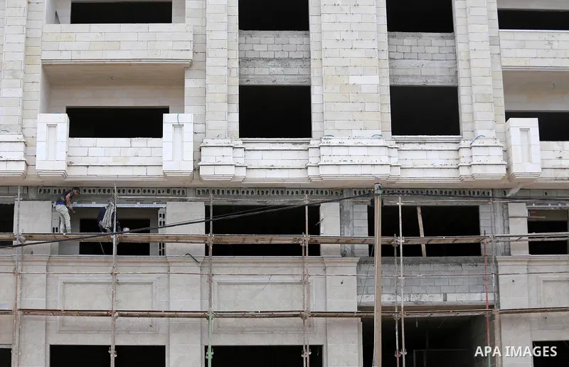 Palestinian laborers construction work at building still under construction, in Gaza city on October 28, 2017. Property owners in the Gaza Strip suffer from weak market and sales, and according to World Bank's report Gaz...