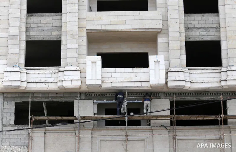 Palestinian laborers construction work at building still under construction, in Gaza city on October 28, 2017. Property owners in the Gaza Strip suffer from weak market and sales, and according to World Bank's report Gaz...