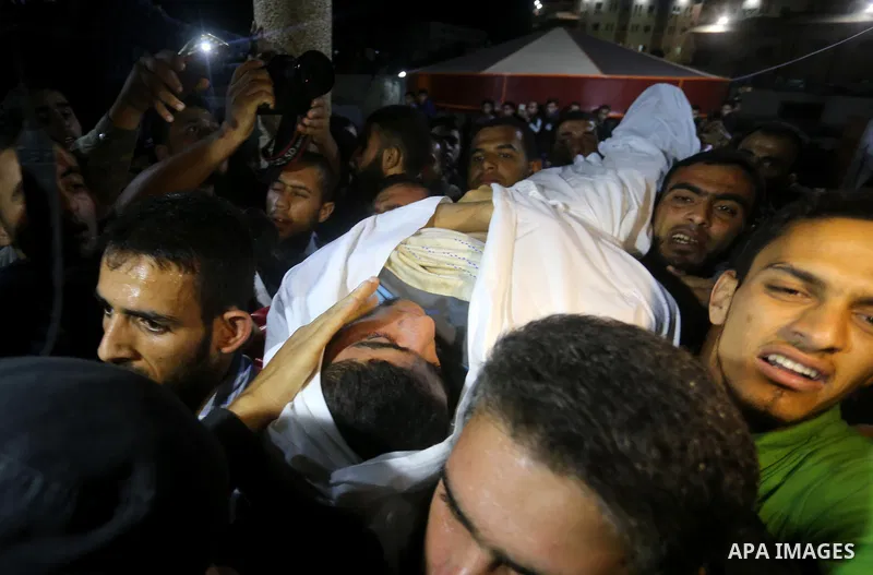The body of Palestinian Marwan Alagha,22, is carried by mourners after he was killed when Israel blew up what it said was a tunnel stretching from the Gaza Strip into its territory, at Naser hospital in Khan Yunis, in th...