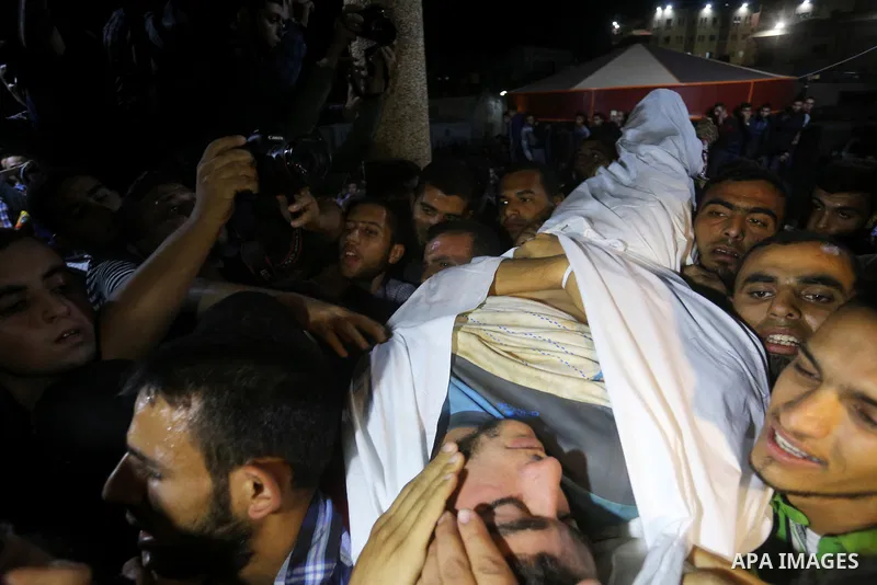The body of Palestinian Marwan Alagha,22, is carried by mourners after he was killed when Israel blew up what it said was a tunnel stretching from the Gaza Strip into its territory, at Naser hospital in Khan Yunis, in th...