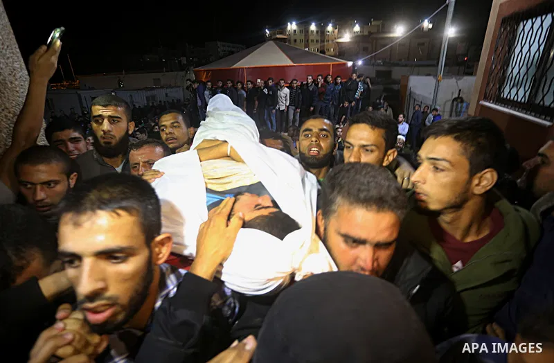 The body of Palestinian Marwan Alagha,22, is carried by mourners after he was killed when Israel blew up what it said was a tunnel stretching from the Gaza Strip into its territory, at Naser hospital in Khan Yunis, in th...