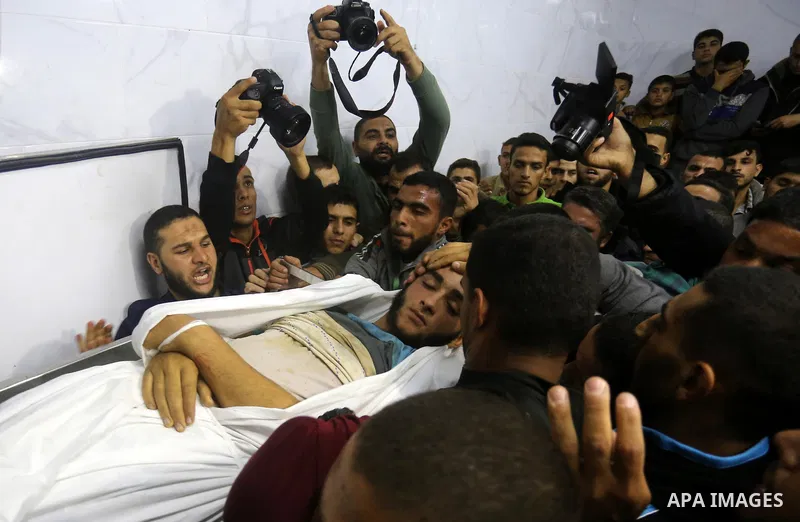 The body of Palestinian Marwan Alagha,22, is carried by mourners after he was killed when Israel blew up what it said was a tunnel stretching from the Gaza Strip into its territory, at Naser hospital in Khan Yunis, in th...
