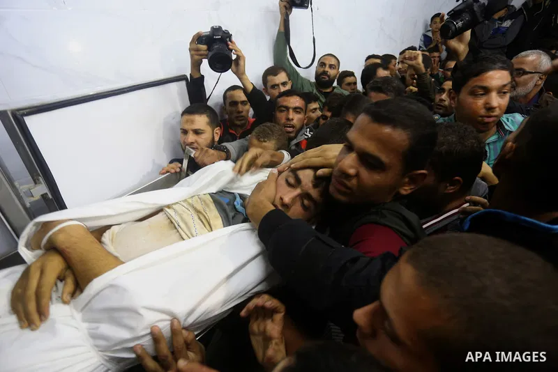 The body of Palestinian Marwan Alagha,22, is carried by mourners after he was killed when Israel blew up what it said was a tunnel stretching from the Gaza Strip into its territory, at Naser hospital in Khan Yunis, in th...