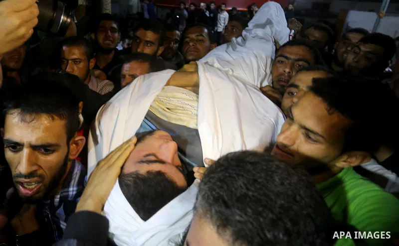 The body of Palestinian Marwan Alagha,22, is carried by mourners after he was killed when Israel blew up what it said was a tunnel stretching from the Gaza Strip into its territory, at Naser hospital in Khan Yunis, in th...