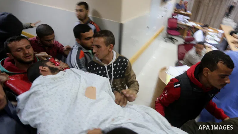 The body of Palestinian Marwan Alagha,22, is carried by mourners after he was killed when Israel blew up what it said was a tunnel stretching from the Gaza Strip into its territory, at Naser hospital in Khan Yunis, in th...