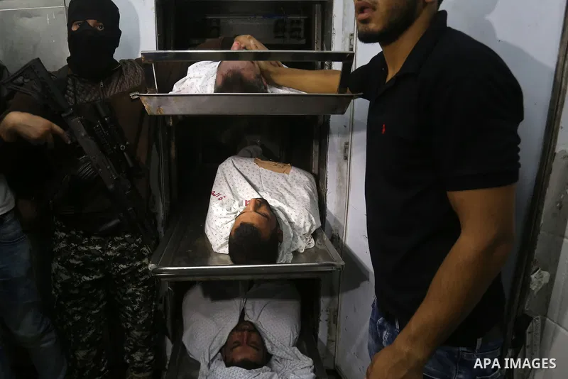 The bodies of Palestinians killed after Israel blew up what it said was a tunnel stretching from the Gaza Strip into its territory, lie at a morgue at al-Aqsa hospital in Deir el-Balah, in central Gaza, on October 30, 20...
