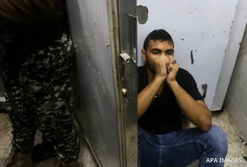 A Palestinian man reacts after his relative was killed after Israel blew up what it said was a tunnel stretching from the Gaza Strip into its territory, at a morgue at al-Aqsa hospital in Deir el-Balah, in central Gaza,...