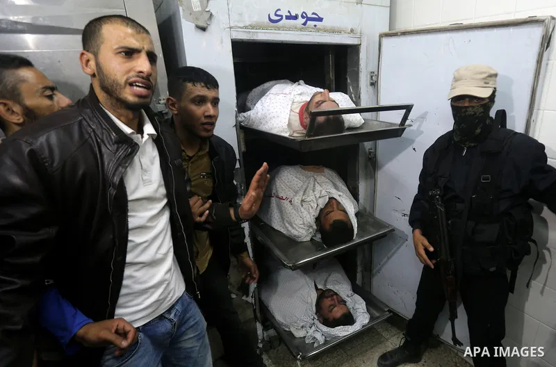 The bodies of Palestinians killed after Israel blew up what it said was a tunnel stretching from the Gaza Strip into its territory, lie at a morgue at al-Aqsa hospital in Deir el-Balah, in central Gaza, on October 30, 20...