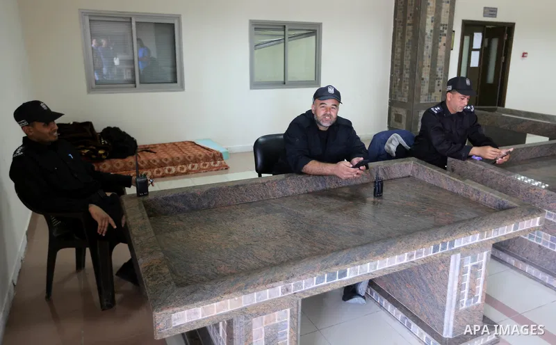 Palestinian Policemen sit at the Rafah border crossing, in the southern Gaza Strip, 31 October 2017. Hamas on 31 October handed over control of the Rafah Border Crossing to the Palestinian authority as part of the Egypti...