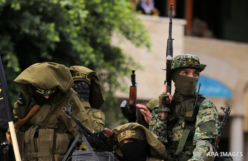 Palestinian Islamic Jihad militants attend the funeral of comrades killed in an Israeli operation to blow up a tunnel stretching from the Gaza Strip into Israel at the Bureij refugee camp, in central Gaza, on October 31,...