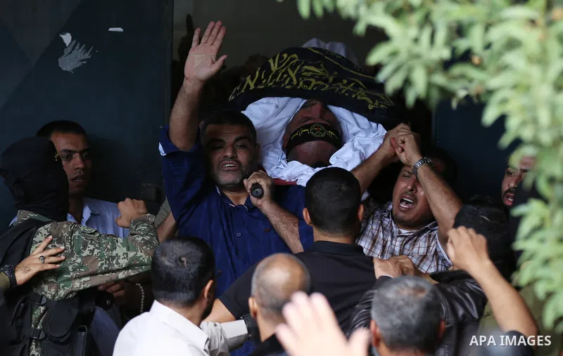 Palestinian Islamic Jihad militants attend the funeral of comrades killed in an Israeli operation to blow up a tunnel stretching from the Gaza Strip into Israel at the Bureij refugee camp, in central Gaza, on October 31,...