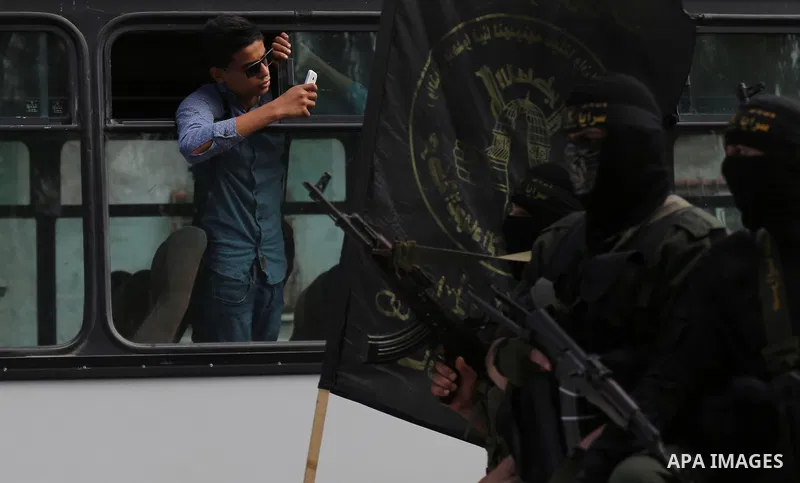 Palestinian Islamic Jihad militants attend the funeral of comrades killed in an Israeli operation to blow up a tunnel stretching from the Gaza Strip into Israel at the Bureij refugee camp, in central Gaza, on October 31,...