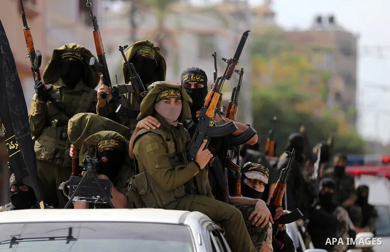 Palestinian Islamic Jihad militants attend the funeral of comrades killed in an Israeli operation to blow up a tunnel stretching from the Gaza Strip into Israel at the Bureij refugee camp, in central Gaza, on October 31,...