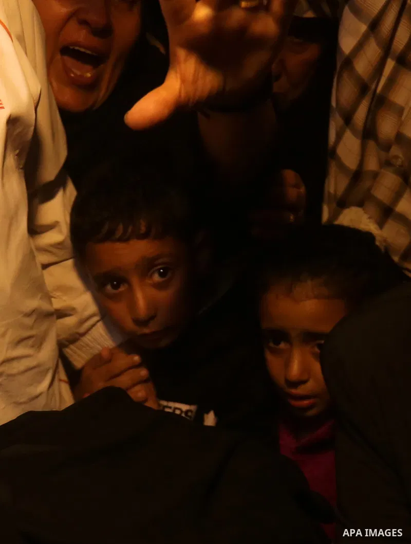 Palestinian relatives of Hassan Abu Hassanin who were killed the previous day in an Israeli operation to blow up a tunnel stretching from the Gaza Strip into Israel, mourn during his funeral in Bureij refugee camp in cen...