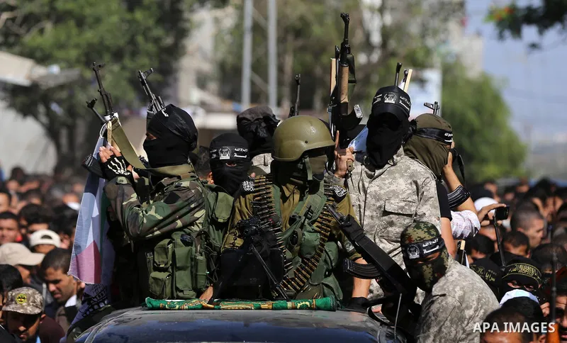 Palestinian relatives of Hassan Abu Hassanin who were killed the previous day in an Israeli operation to blow up a tunnel stretching from the Gaza Strip into Israel, mourn during his funeral in Bureij refugee camp in cen...