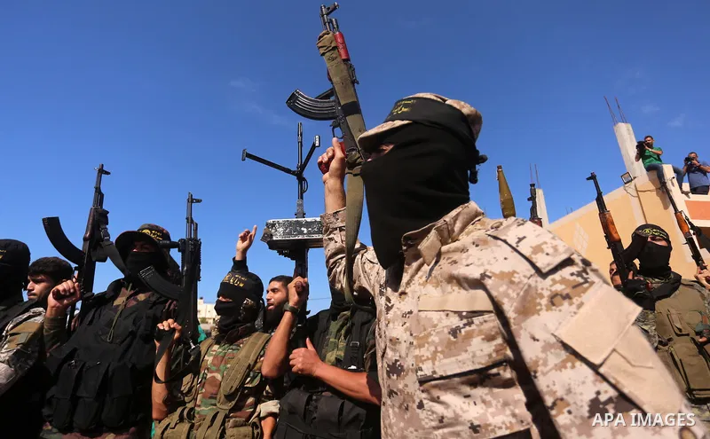 Palestinian Islamic Jihad militants attend the funeral of comrades killed in an Israeli operation to blow up a tunnel stretching from the Gaza Strip into Israel at the Bureij refugee camp, in central Gaza, on October 31,...