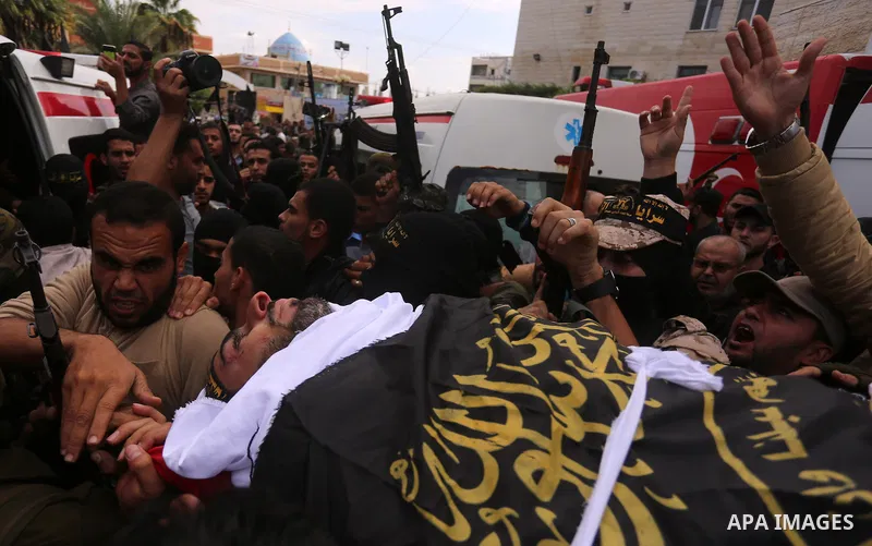 Palestinian mourners carry the body of Hassan Abu Hassanin in Bureij refugee camp in central Gaza Strip on October 31, 2017, during the funeral of Palestinians who were killed the previous day in an Israeli operation to...