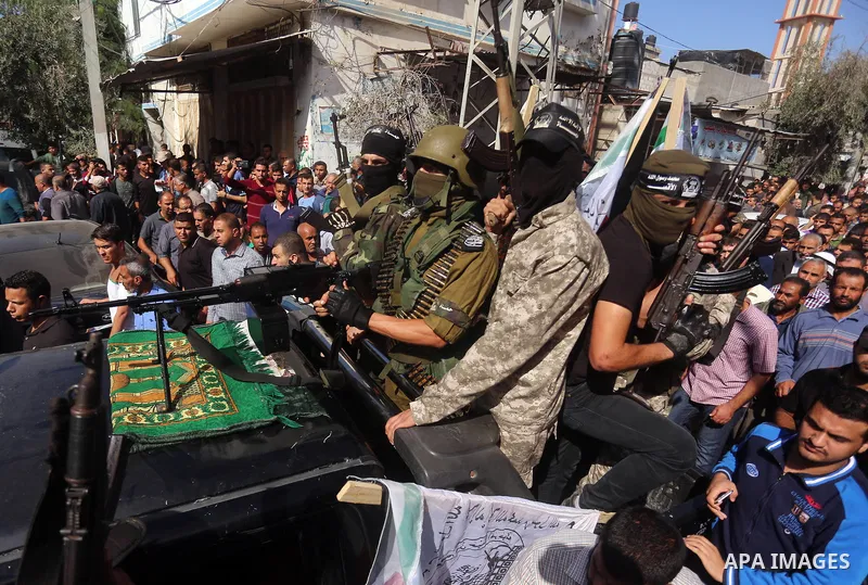 Palestinian Islamic Jihad militants attend the funeral of comrades killed in an Israeli operation to blow up a tunnel stretching from the Gaza Strip into Israel at the Bureij refugee camp, in central Gaza, on October 31,...