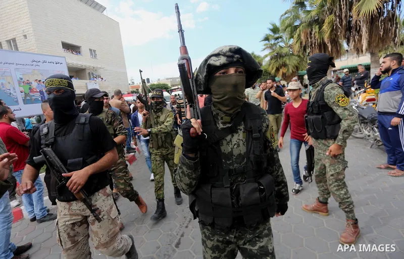 Palestinian Islamic Jihad militants attend the funeral of one of the Palestinians killed in an Israeli operation to blow up a tunnel stretching from the Gaza Strip into Israel in Bureij refugee camp in central Gaza Strip...