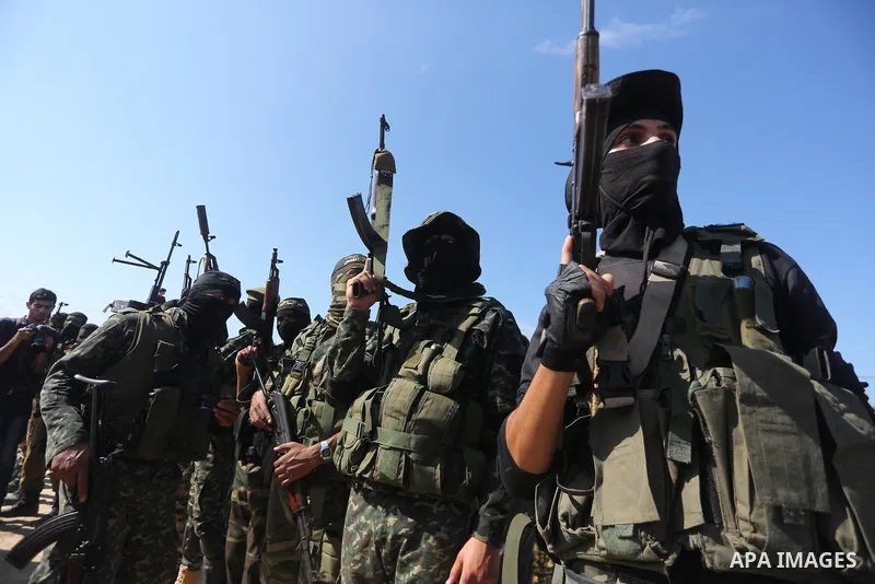 Palestinian Islamic Jihad militants attend the funeral of one of the Palestinians killed in an Israeli operation to blow up a tunnel stretching from the Gaza Strip into Israel in Bureij refugee camp in central Gaza Strip...