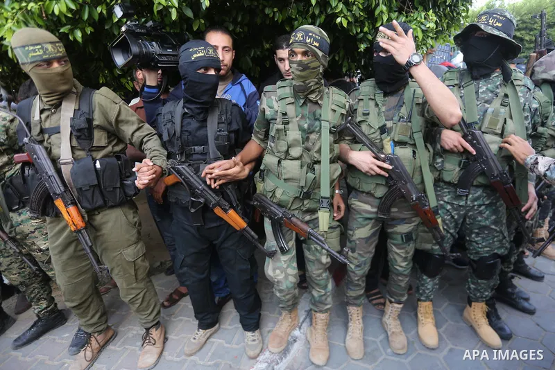Palestinian Islamic Jihad militants attend the funeral of one of the Palestinians killed in an Israeli operation to blow up a tunnel stretching from the Gaza Strip into Israel in Bureij refugee camp in central Gaza Strip...
