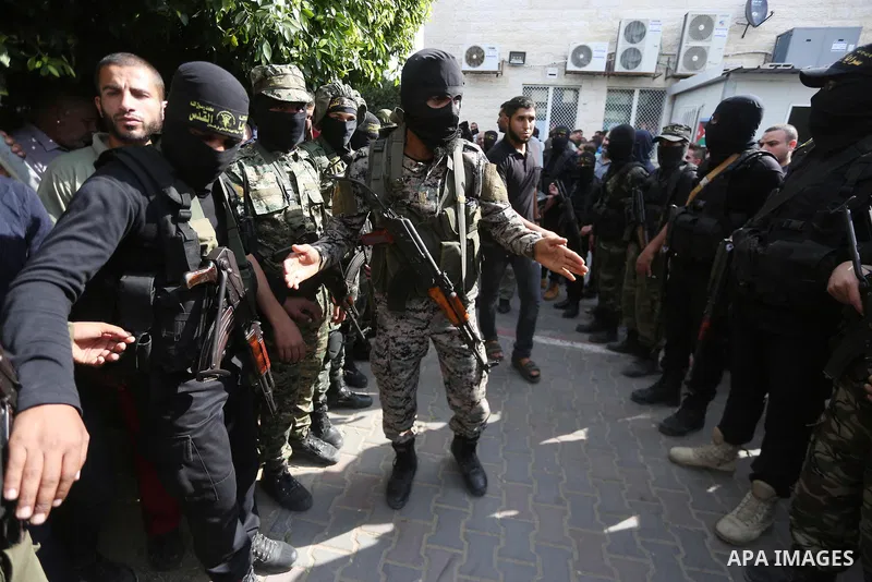 Palestinian Islamic Jihad militants attend the funeral of one of the Palestinians killed in an Israeli operation to blow up a tunnel stretching from the Gaza Strip into Israel in Bureij refugee camp in central Gaza Strip...