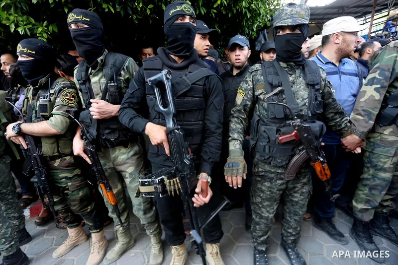 Palestinian Islamic Jihad militants attend the funeral of one of the Palestinians killed in an Israeli operation to blow up a tunnel stretching from the Gaza Strip into Israel in Bureij refugee camp in central Gaza Strip...