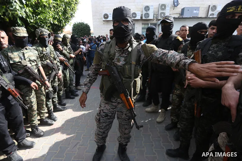Palestinian Islamic Jihad militants attend the funeral of one of the Palestinians killed in an Israeli operation to blow up a tunnel stretching from the Gaza Strip into Israel in Bureij refugee camp in central Gaza Strip...
