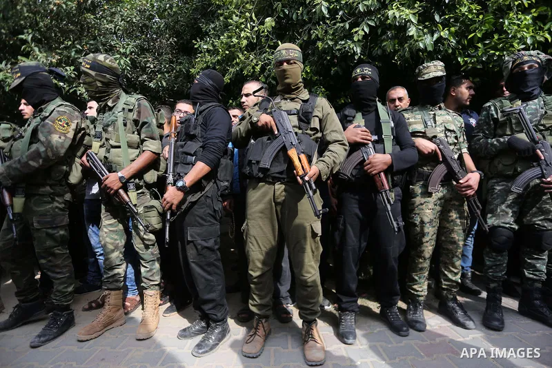 Palestinian Islamic Jihad militants attend the funeral of one of the Palestinians killed in an Israeli operation to blow up a tunnel stretching from the Gaza Strip into Israel in Bureij refugee camp in central Gaza Strip...