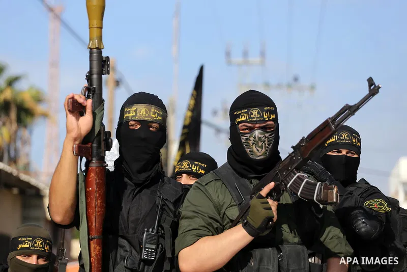 Palestinian Islamic Jihad militants attend the funeral of one of the Palestinians killed in an Israeli operation to blow up a tunnel stretching from the Gaza Strip into Israel in Bureij refugee camp in central Gaza Strip...