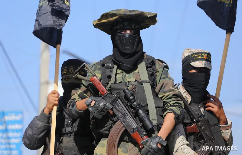Palestinian Islamic Jihad militants attend the funeral of one of the Palestinians killed in an Israeli operation to blow up a tunnel stretching from the Gaza Strip into Israel in Bureij refugee camp in central Gaza Strip...