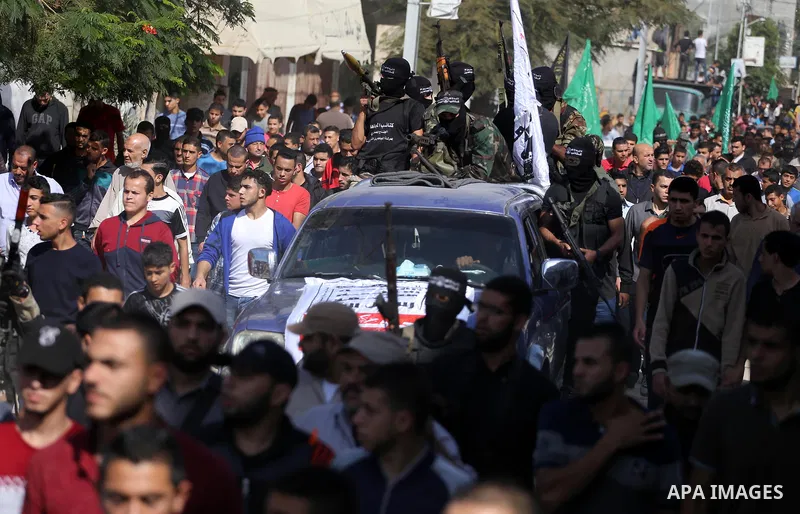 Palestinian Islamic Jihad militants attend the funeral of one of the Palestinians killed in an Israeli operation to blow up a tunnel stretching from the Gaza Strip into Israel in Bureij refugee camp in central Gaza Strip...