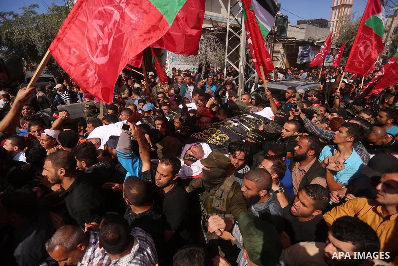 Palestinian mourners carry the body of Palestinian Islamic Jihad Movement fighter Arafat Abu Morshed during the funeral of Palestinians killed in an Israeli operation to blow up a tunnel stretching from the Gaza Strip in...